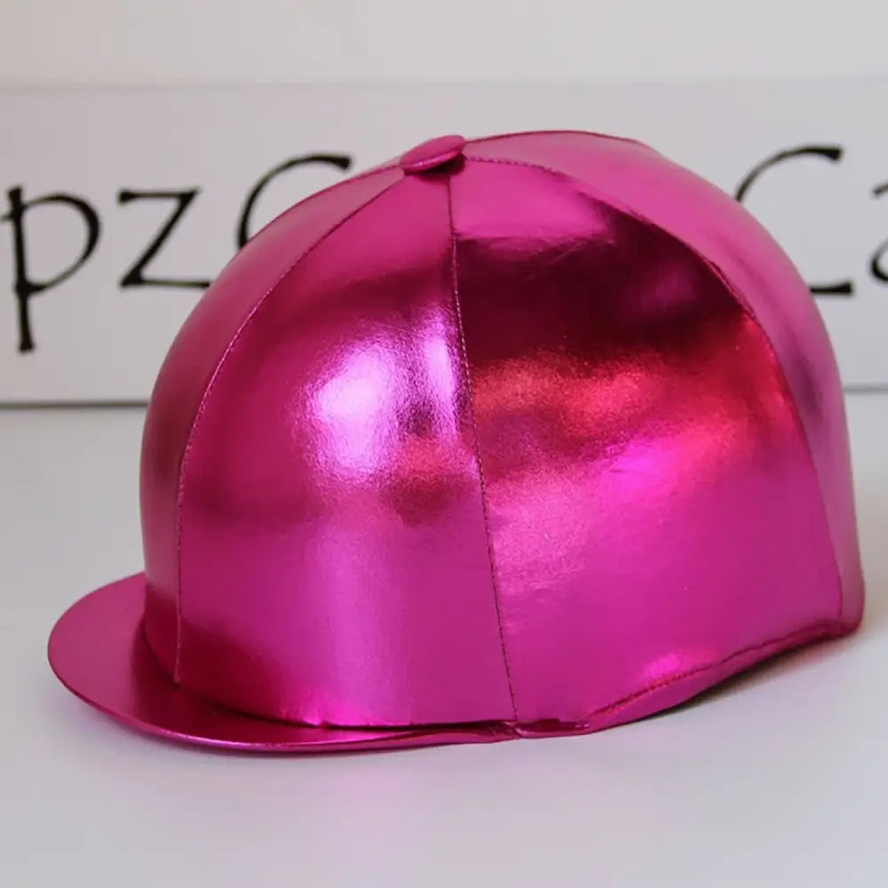 A shiny metallic pink equestrian helmet with a smooth reflective surface in capz metallic cap lycra foil cerise design