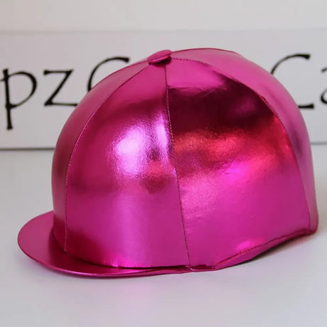 A shiny metallic pink equestrian helmet with a smooth reflective surface in capz metallic cap lycra foil cerise design