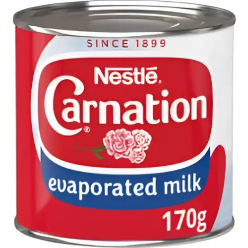 Caranation evaporated milk 170g can with red white and blue branding perfect for cooking and baking