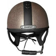 A shimmering bronze rose gold riding helmet with black stripe and champion ventair sport emblem for ventair sport riding