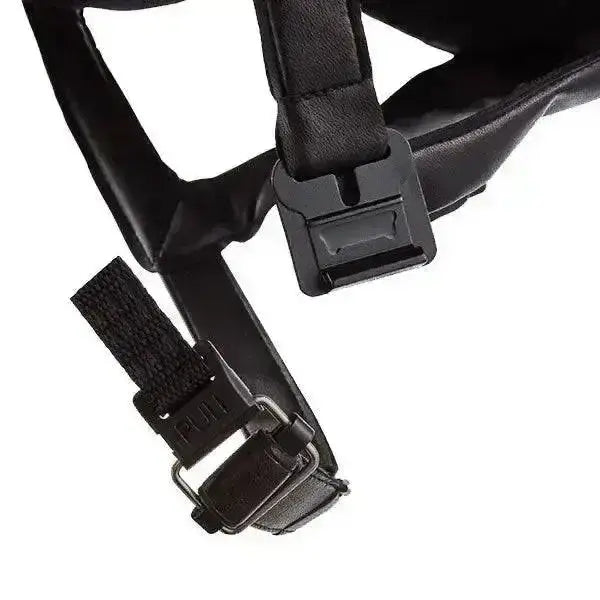 Black nylon strap with plastic buckle and metal hardware on the back of charles owen 4star riding hat