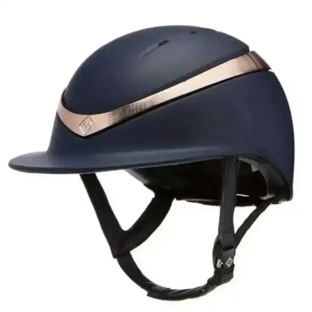 Navy blue charles owen halo matt equestrian helmet with rose gold stripe and black adjustable straps wide peak