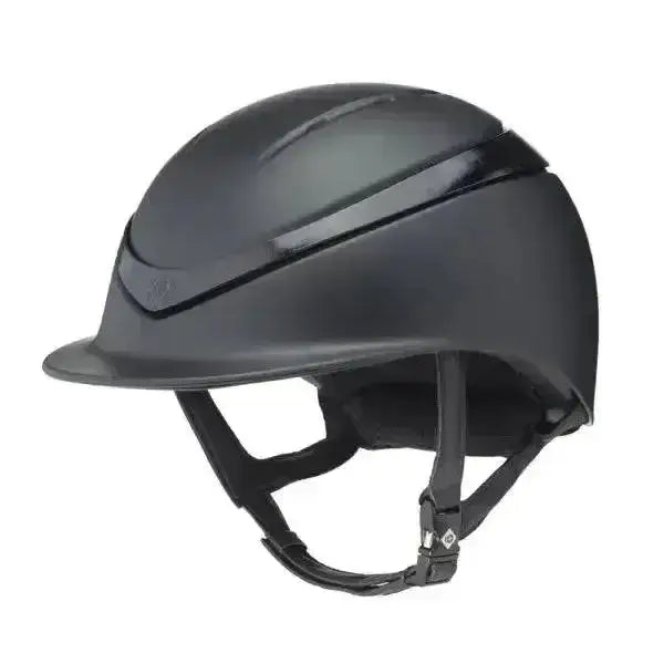 Black charles owen halo riding helmet with glossy finish and integrated chin strap for safe riding use