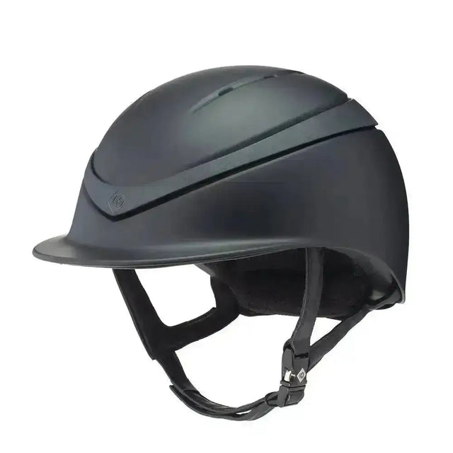 Matte black charles owen halo riding helmet with sleek design and adjustable straps for equestrian use