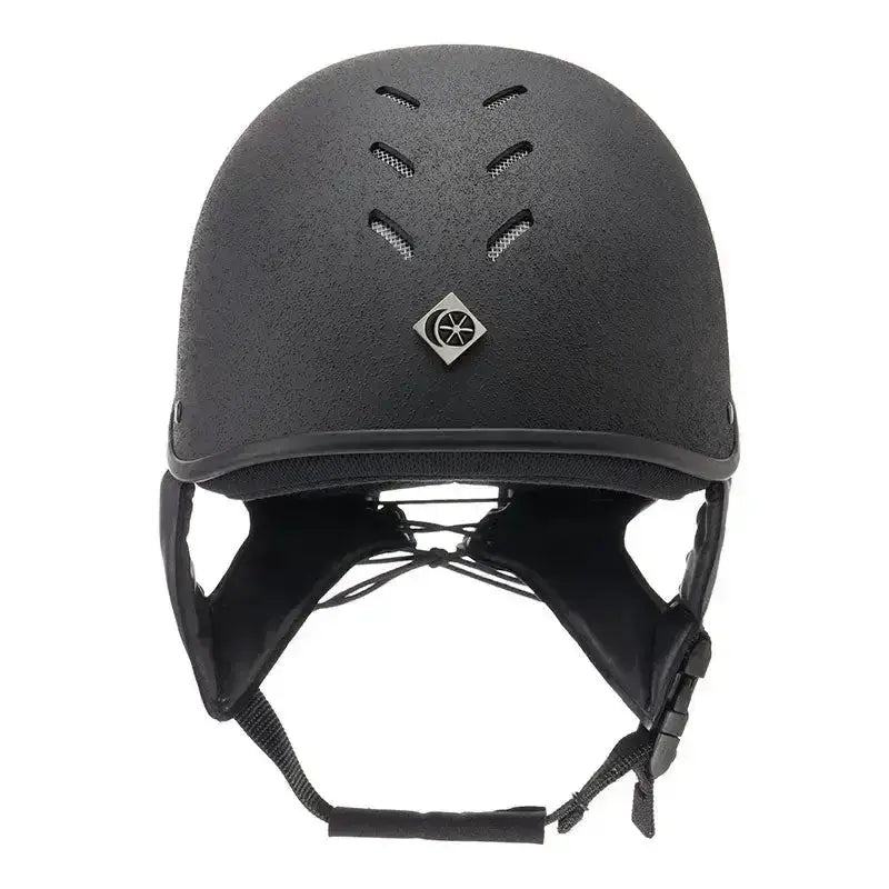 Black charles owen js1 pro riding hat with matte finish ventilation slots and silver diamond badge on front