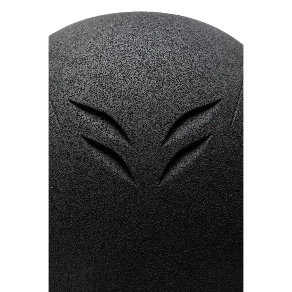 Black textured speaker grille with a v-shaped cutout on the back of the charles owen phoenix jockey skull