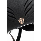 Black textured charles owen phoenix jockey skull equestrian helmet with rose gold hexagonal geometric emblem