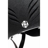 Black textured charles owen phoenix jockey skull helmet with sleek silver hexagonal geometric emblem
