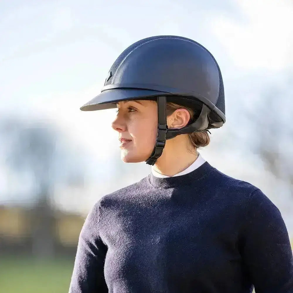 Dark blue charles owen sp8 leather riding hat with mesh panel back and black adjustable straps visible from behind