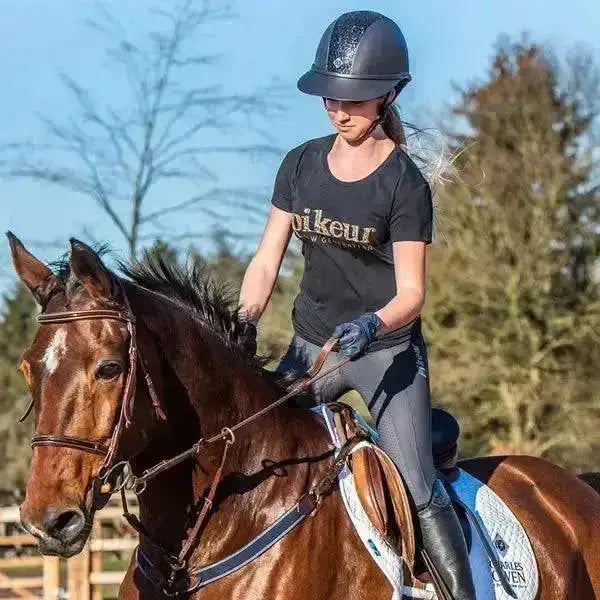 Black charles owen sp8 sparkly riding hat with subtle textured finish perfect for equestrian use