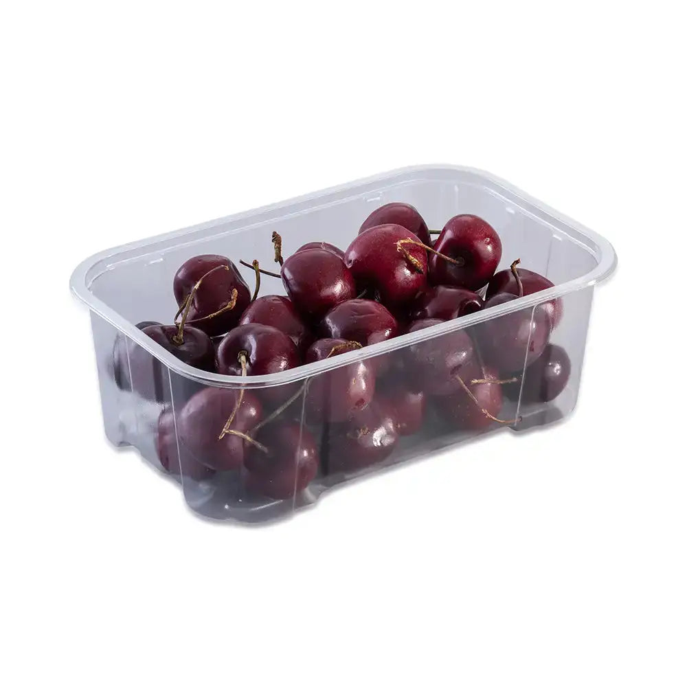 A clear plastic container of glossy dark red cherries with stems perfect for horse treats or somerset strawberries fans