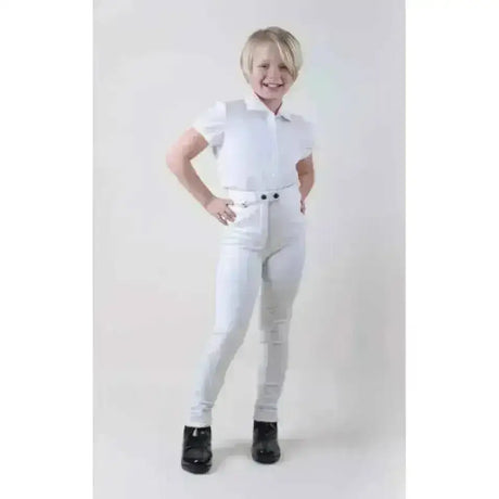 White cotton stretch childrens jodhpurs rhinegold with matching polo shirt and black boots for riding use