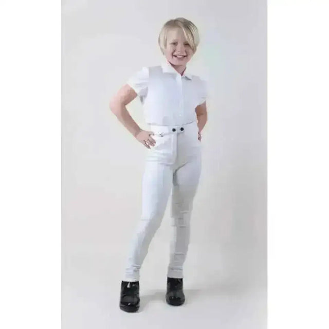 White cotton stretch childrens jodhpurs rhinegold with matching polo shirt and black boots for riding use
