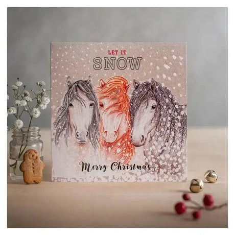 Christmas card let it snow with three horses and snowflakes on eco kraft fleck textured board beige background