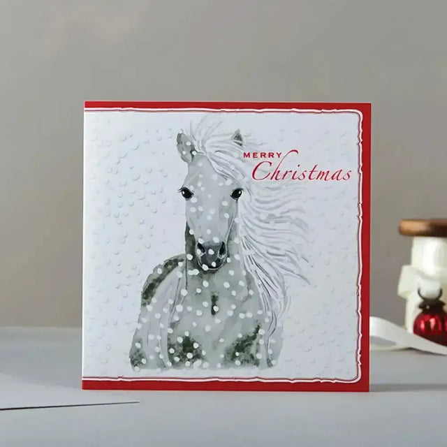 A white christmas card rosa merry christmas with red border gray horse and snowflakes on eco kraft fleck material