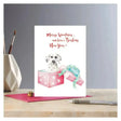 A white christmas card rosa featuring a dalmatian puppy in a pink gift box on eco kraft fleck paper with rosa merry woofmas text