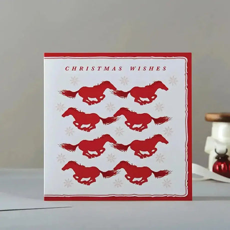 A red and white christmas card rosa christmas wishes with galloping horse silhouettes and eco kraft fleck snowflakes