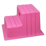 Pink plastic two-step mounting blocks with ribbed texture and hole on upper step from classic showjumps