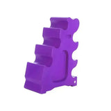 Purple plastic dumbbell rack with tiered slots for organizing weights from classic showjumps sloping block