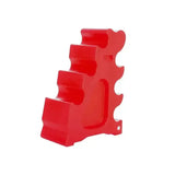 Red plastic toy dinosaur with glossy finish and segmented body next to classic showjumps sloping block popular selling jump