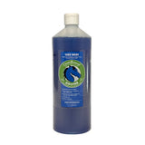 Cleanround fragranced yard wash in a clear plastic bottle with blue liquid and green label for fresh horse yards