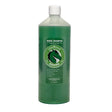 Green plastic bottle of cleanround medicated shampoo cedarwood with white cap and label showing cedarwood formula