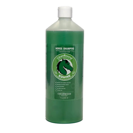 Green plastic bottle of cleanround medicated shampoo cedarwood with white cap and label showing cedarwood formula