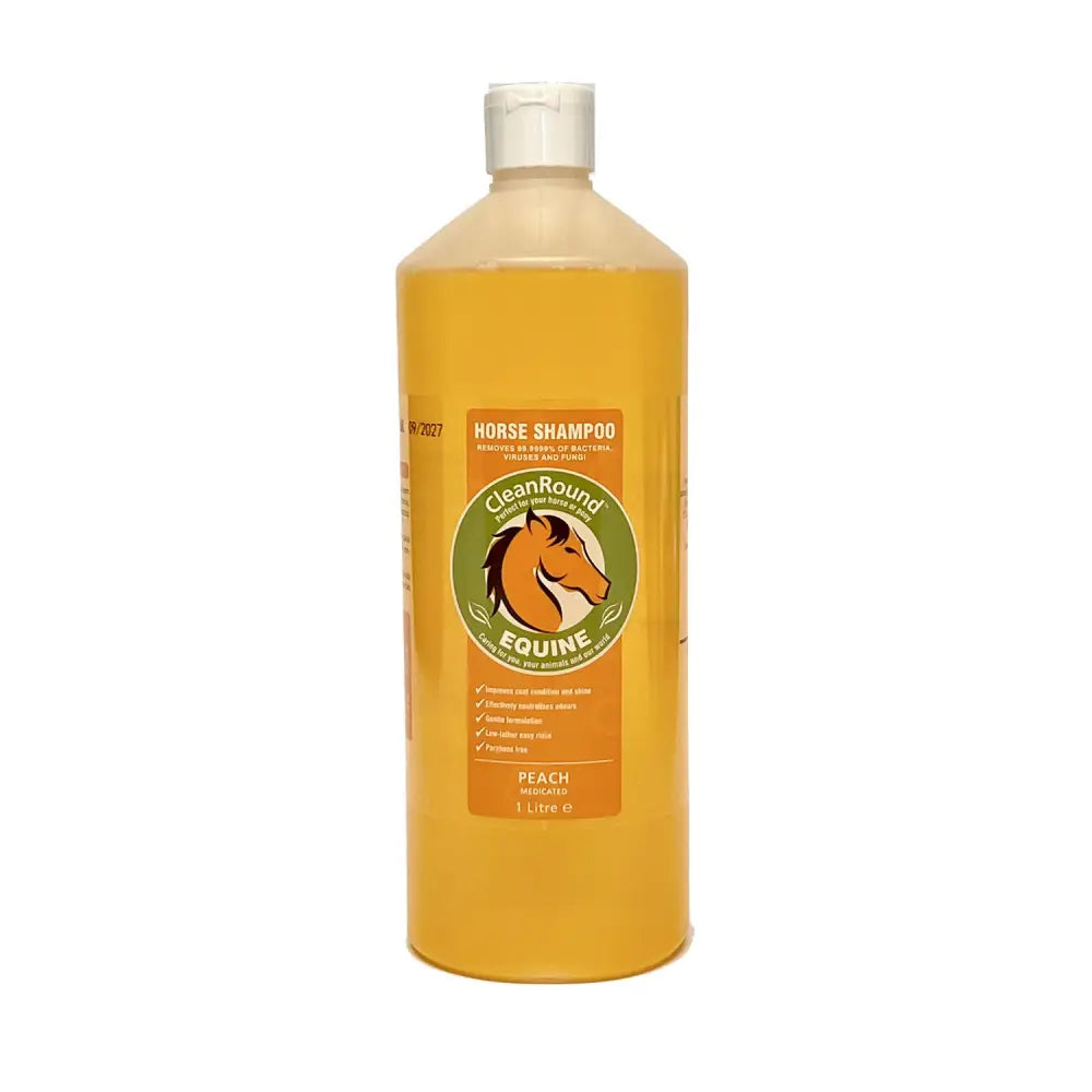 A translucent amber bottle of cleanround medicated shampoo peach with white flip top cap and orange label with horse logo
