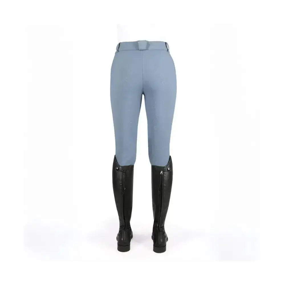 Light blue coldstream balmore thermal riding tights with brushed fleece and fitted design paired with black knee boots