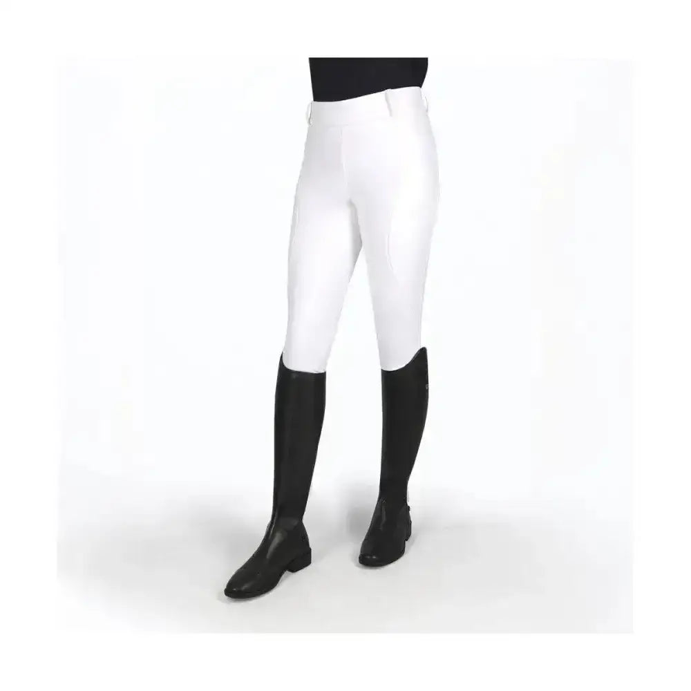 White coldstream balmore thermal riding tights with brushed fleece lining and black knee-high boots for winter rides