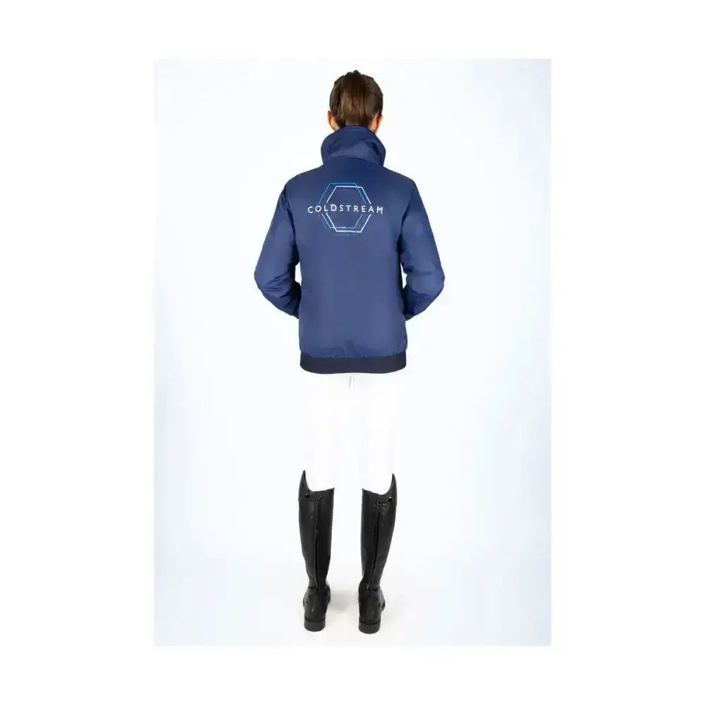 Navy blue coldstream lanton blouson back view with white hexagonal logo and high rise collar for equestrian use