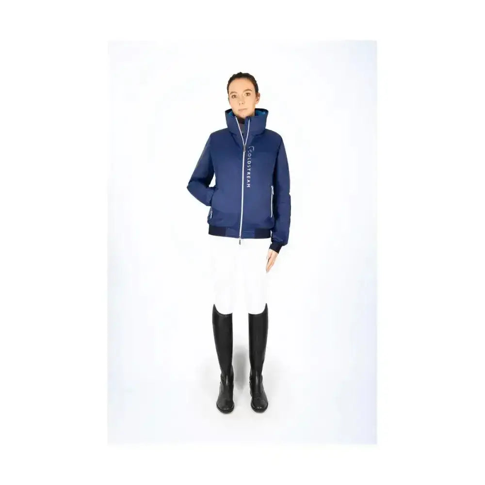 Navy blue insulated coldstream lanton blouson with white zipper and high rise collar for equestrian use