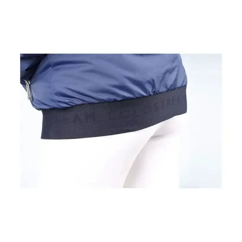 Navy blue coldstream lanton blouson puffer jacket with black ribbed trim and high rise collar featuring embossed branding