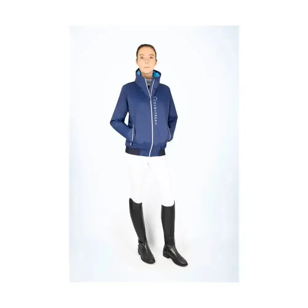 Navy blue coldstream lanton blouson jacket with white zipper trim high rise collar and branded text on left sleeve