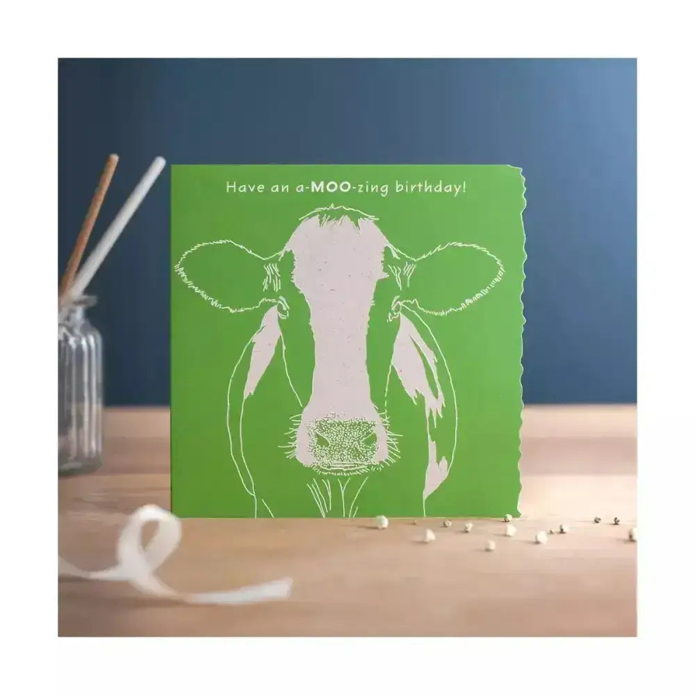 Green colour block happy birthday card with a white cow line art and moo zing birthday text individually cello wrapped