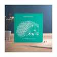 Teal colour block happy birthday hogs card with white laser-cut hedgehog and text happy birthday hogs and kisses