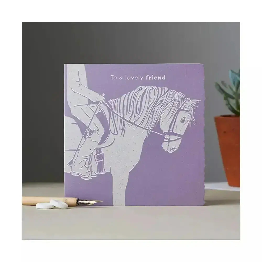 Purple colour block pony card featuring white line-art horse and rider with to a lovely friend text above