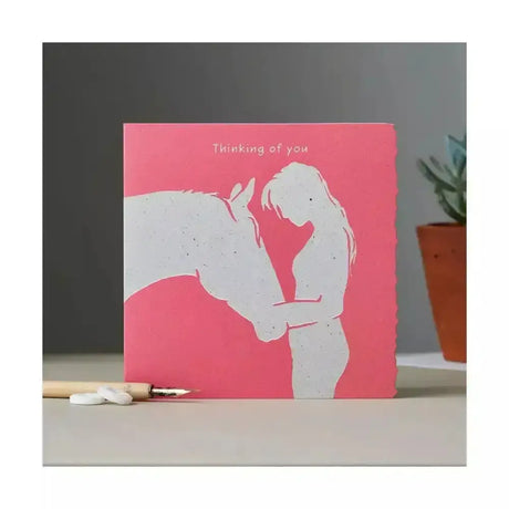 Pink colour block pony card with white silhouette of woman hugging horse and thinking of you text in original watercolour design