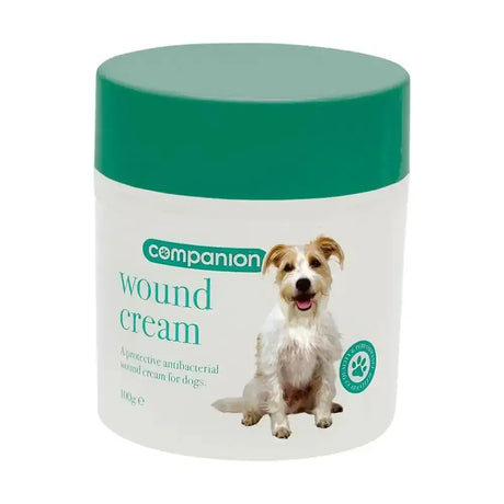 Companion wound cream in a white jar with a green lid featuring a smiling dog is a protective antibacterial wound cream