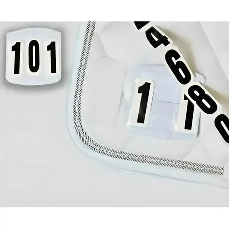White athletic shoe with black numerical decals and silver chain detail featuring competition numbers velcro compartments