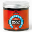 A cylindrical container of carr & day & martins cornucrescine original hoof ointment with a bright orange label for coronet band care