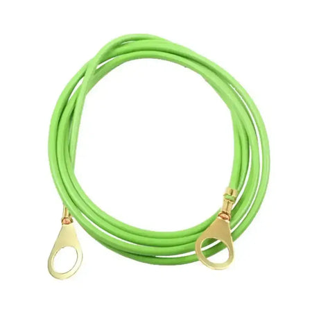 Bright green coiled corral ground connection cable with gold-colored terminal connectors for secure grounding