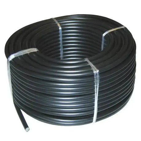 Black ribbed plastic tubing coiled and tied for corral high voltage underground cable use