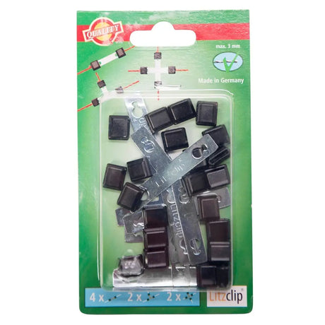 Black plastic and metal litzclip fasteners in green package for corral repair kit litzclip galvanised used for repairing sheep