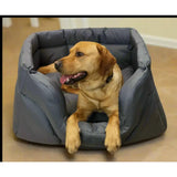 A cozy dark gray cushioned heavy duty rectangular high sided waterproof dog bed with soft padded interior and sturdy fabric