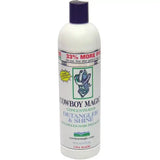 White plastic bottle of cowboy magic detangler with dark purple cap and label featuring cowboy hat for mane and tail shine