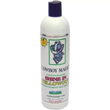 White plastic bottle with dark purple cap labeled cowboy magic yellowout stain removing concentrated shine shampoo