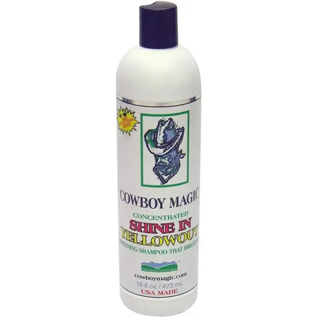 White plastic bottle with dark purple cap labeled cowboy magic yellowout stain removing concentrated shine shampoo