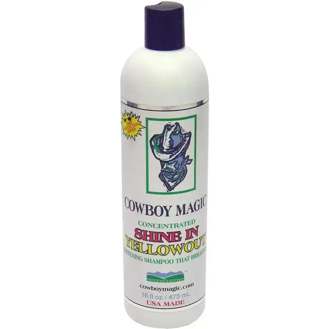 White plastic bottle with dark purple cap labeled cowboy magic yellowout stain removing concentrated shine shampoo