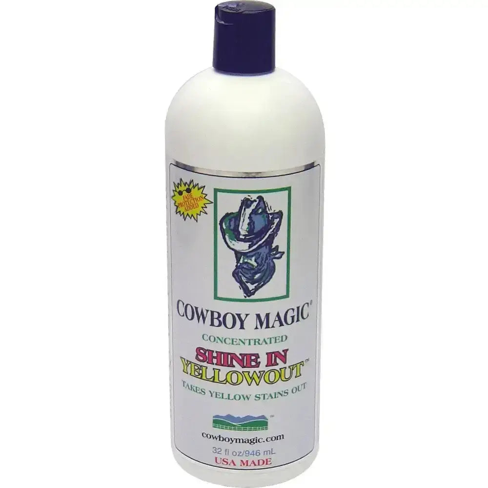 White plastic bottle with dark blue cap labeled cowboy magic yellowout stain removing shampoo for yellow stains